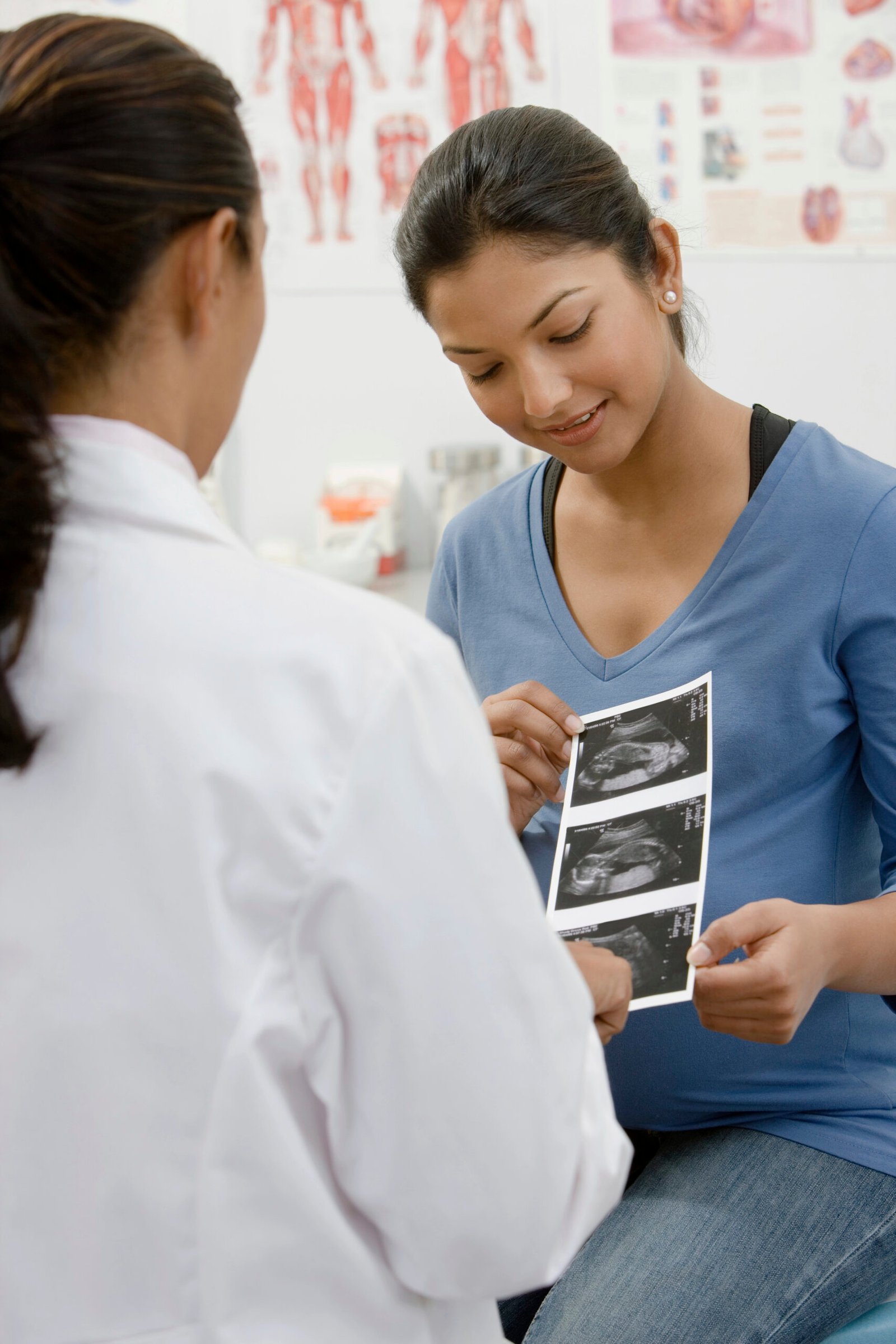 A doctor handing a patient a scan